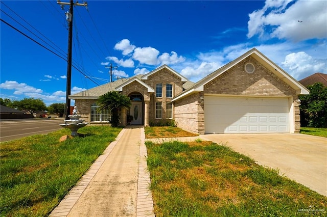 view of front of house with a garage and a front lawn