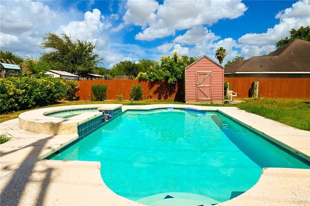 view of pool featuring an in ground hot tub and a storage shed