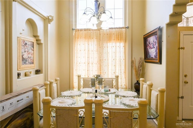 dining area with an inviting chandelier