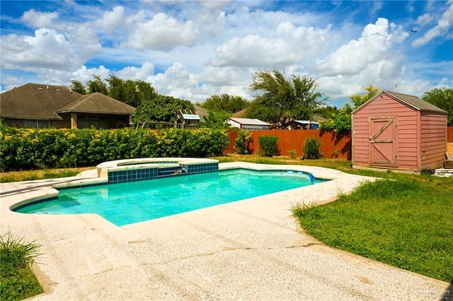 view of pool with an in ground hot tub and a shed