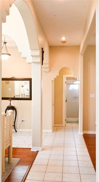 hallway featuring tile patterned flooring