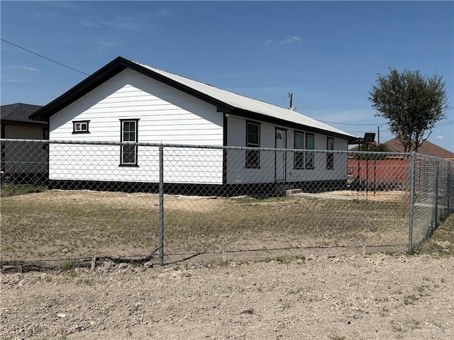 view of property exterior featuring fence