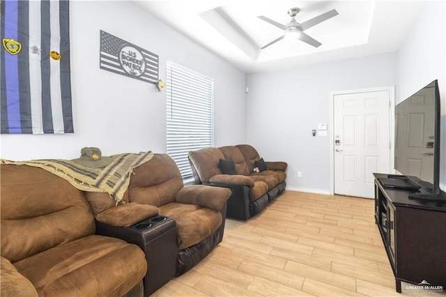 3301 S Colt Ln, Edinburg, TX 78539 - living area with a raised ceiling, a ceiling fan, light wood-style floors, a skylight, and baseboards