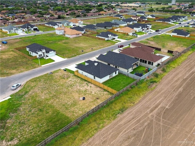 birds eye view of property with a residential view