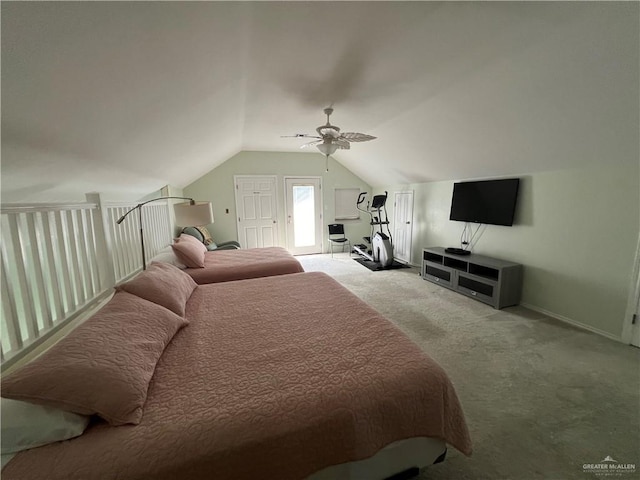 bedroom with lofted ceiling, a ceiling fan, and carpet flooring