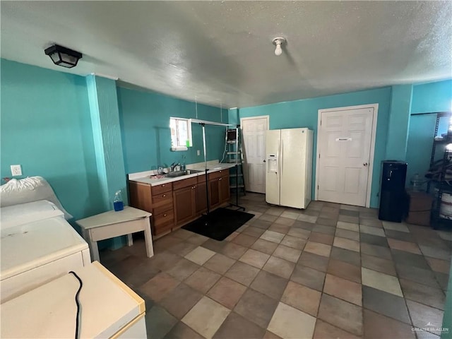 bathroom featuring a textured ceiling and vanity