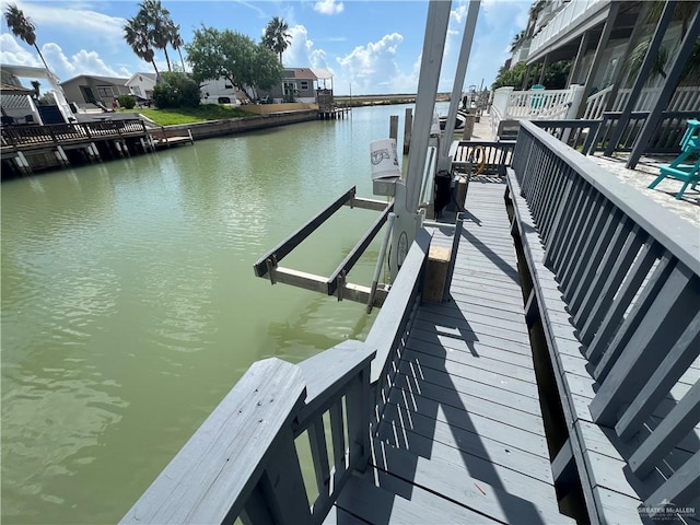 dock area featuring a water view and boat lift