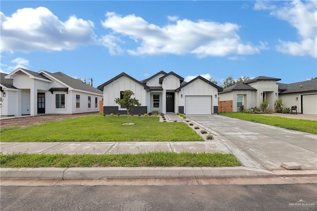 view of front of house featuring a garage and a front lawn