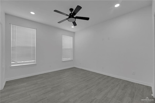 unfurnished room with ceiling fan and light hardwood / wood-style flooring