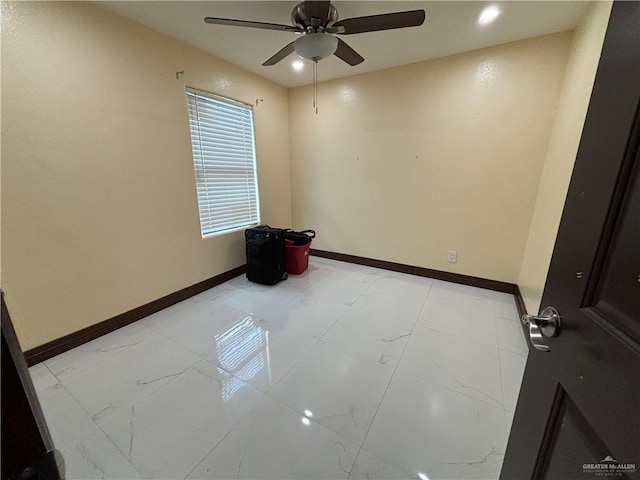 spare room featuring ceiling fan