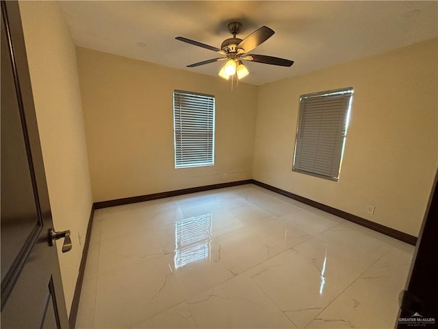 unfurnished room with ceiling fan