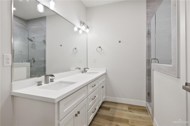 2615 E Solar Dr, Mission, TX 78574 - full bath featuring double vanity, a stall shower, and wood finished floors