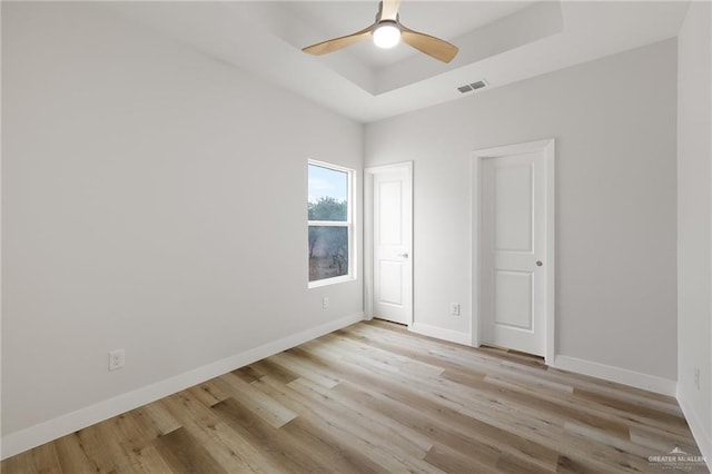 2615 E Solar Dr, Mission, TX 78574 - unfurnished room with a tray ceiling, light wood-type flooring, and ceiling fan