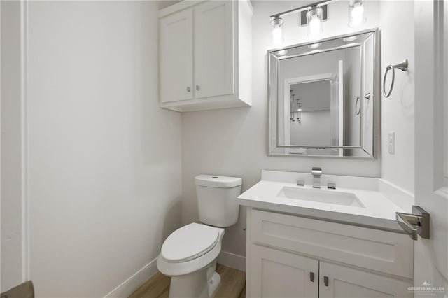 2615 E Solar Dr, Mission, TX 78574 - half bathroom featuring vanity and wood finished floors