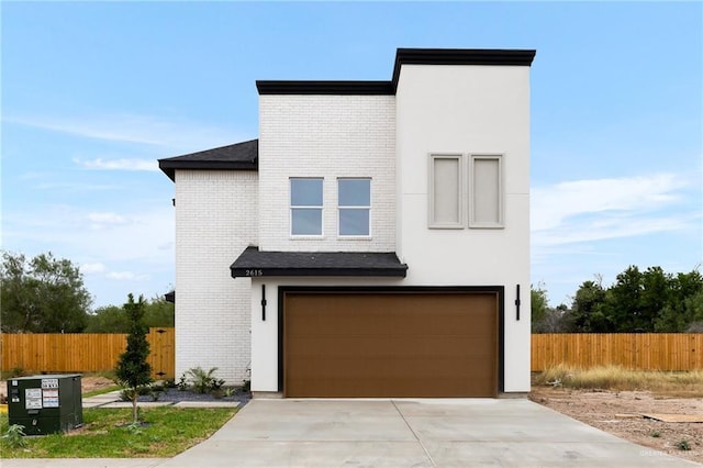 2615 E Solar Dr, Mission, TX 78574 - contemporary home featuring brick siding, a garage, and concrete driveway