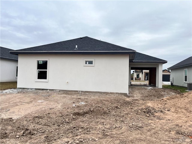 back of house featuring central AC