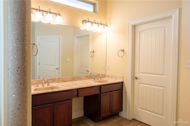 bathroom with tile patterned flooring and vanity