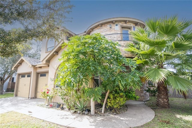 exterior space featuring a balcony and a garage