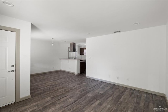 2120 Grambling Ave, Mcallen, TX 78504 - unfurnished living room featuring dark wood-style floors, baseboards, and recessed lighting