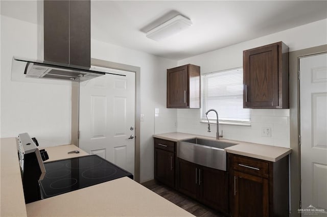 2120 Grambling Ave, Mcallen, TX 78504 - kitchen featuring island exhaust hood, a sink, range with electric stovetop, decorative backsplash, and dark brown cabinets