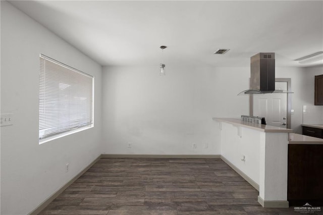 2120 Grambling Ave, Mcallen, TX 78504 - unfurnished dining area featuring dark wood finished floors and baseboards