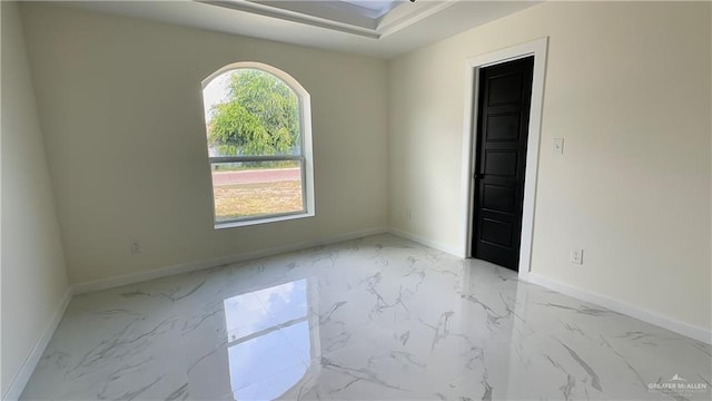 empty room with marble finish floor and baseboards