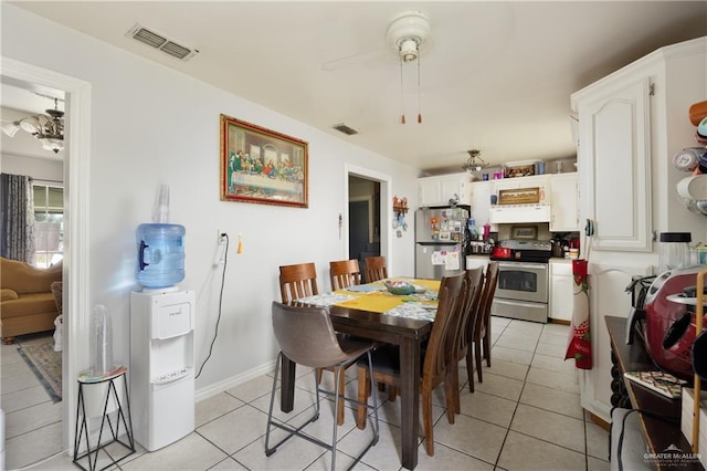 dining room with ceiling fan and light tile patterned floors