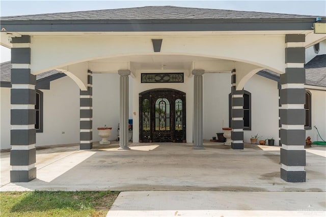 10766 N Minnesota Rd, Mission, TX 78574 - doorway to property featuring a shingled roof and stucco siding