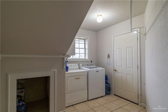 10766 N Minnesota Rd, Mission, TX 78574 - laundry room featuring washing machine and clothes dryer and light tile patterned floors