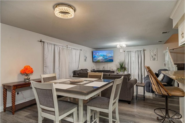 10766 N Minnesota Rd, Mission, TX 78574 - dining space with wood finished floors and a textured ceiling
