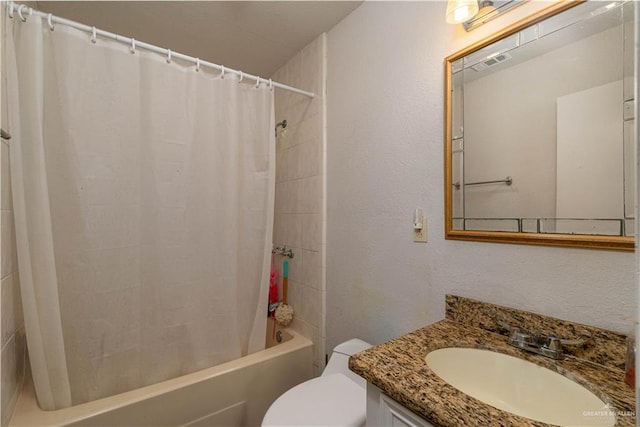 10766 N Minnesota Rd, Mission, TX 78574 - bathroom featuring vanity, shower / bath combo with shower curtain, toilet, and a textured wall