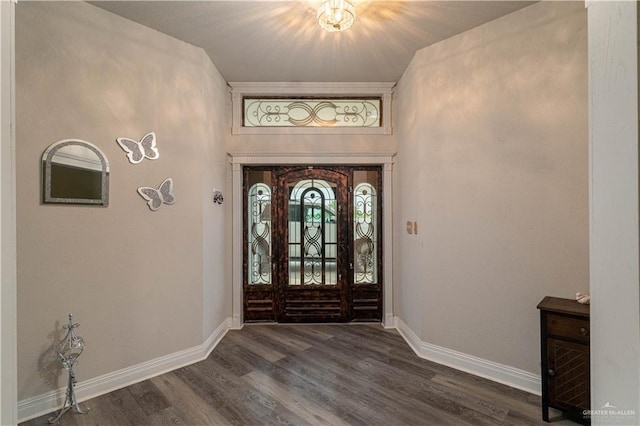 10766 N Minnesota Rd, Mission, TX 78574 - entrance foyer featuring dark wood-style flooring, baseboards, and a chandelier
