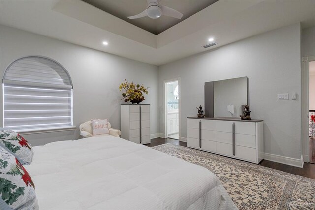 bedroom featuring dark hardwood / wood-style flooring and ceiling fan