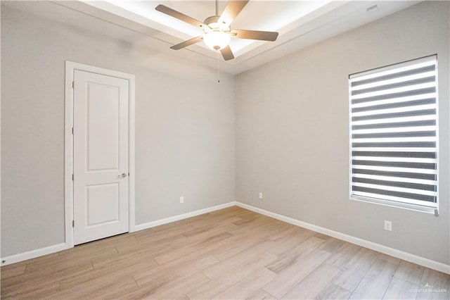 2509 Viola St, Mission, TX 78574 - empty room with a ceiling fan, light wood-style flooring, and baseboards