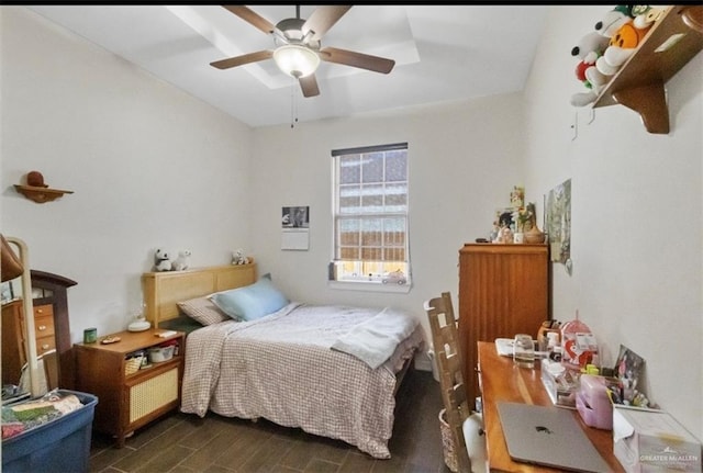 bedroom featuring a ceiling fan and wood finished floors