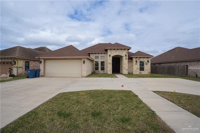 view of front facade featuring a garage and a front lawn