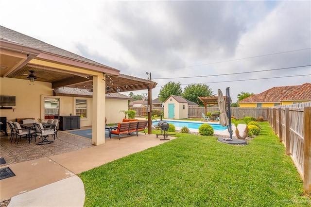 view of yard with an outdoor structure, a pergola, a fenced backyard, an outdoor hangout area, and a storage unit