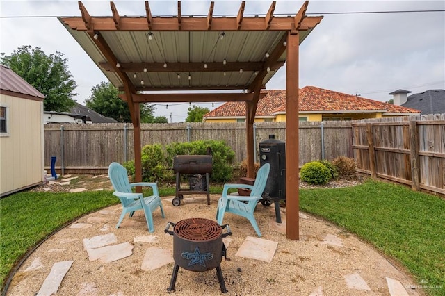 view of patio with a fenced backyard and grilling area