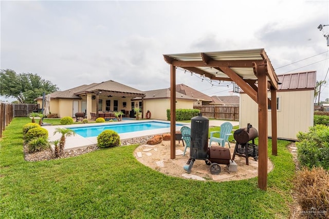 view of pool with a lawn, a fenced in pool, a fenced backyard, and a patio area
