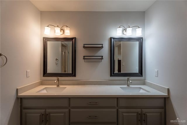 full bath featuring double vanity and a sink