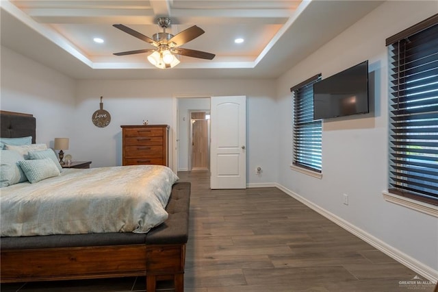 bedroom with a raised ceiling, baseboards, a ceiling fan, and dark wood finished floors