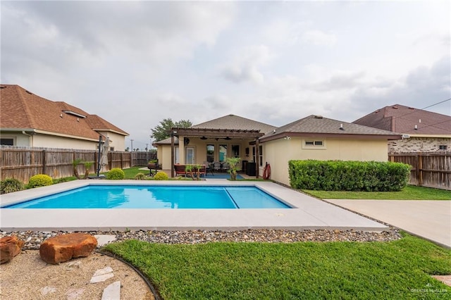 view of swimming pool with a fenced in pool, a fenced backyard, a lawn, and a patio area