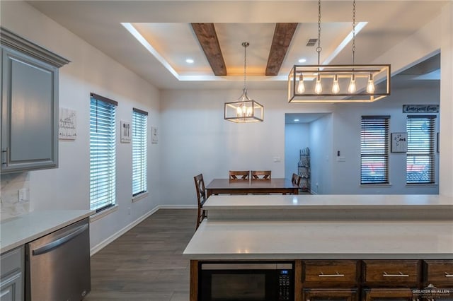 dining room with a notable chandelier, baseboards, a tray ceiling, visible vents, and dark wood-style floors