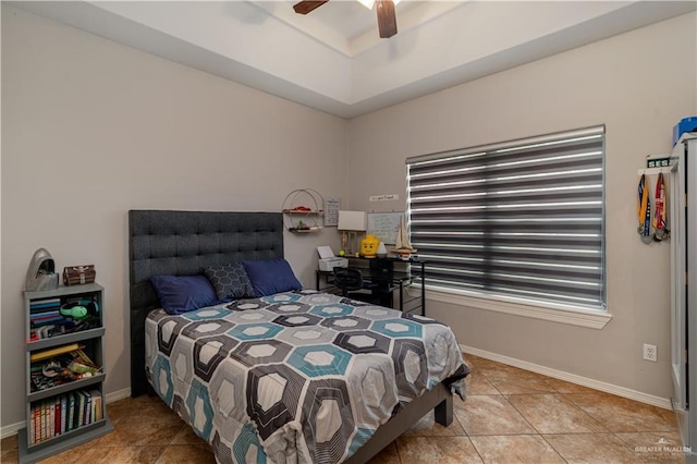 bedroom featuring ceiling fan, baseboards, and light tile patterned floors