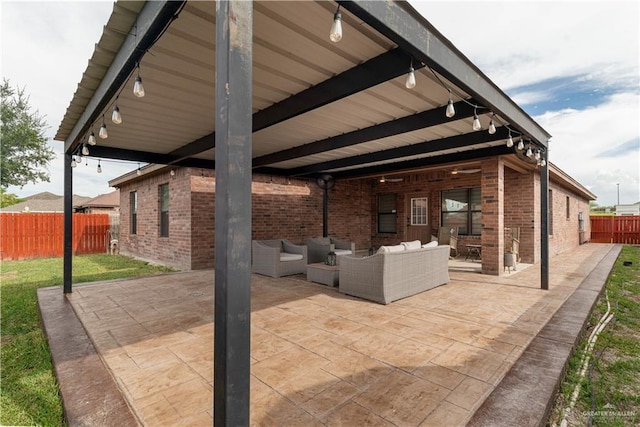 view of patio featuring a fenced backyard and an outdoor living space