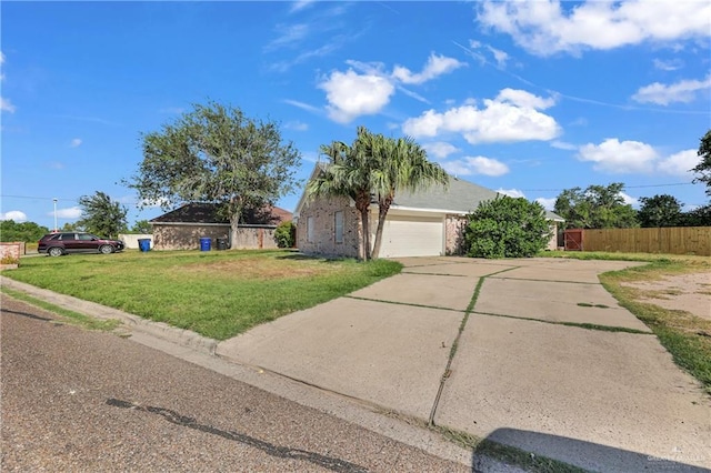 ranch-style house with concrete driveway, fence, a front lawn, and an attached garage