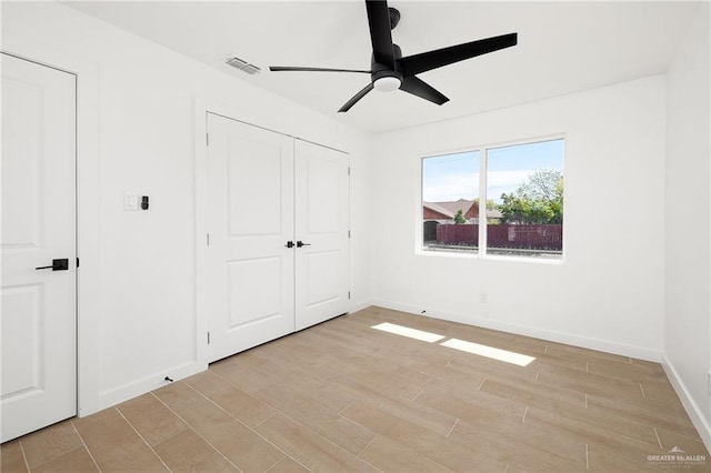 2901 Upas Ave, Mcallen, TX 78501 - unfurnished bedroom featuring visible vents, baseboards, a closet, light wood-type flooring, and a ceiling fan