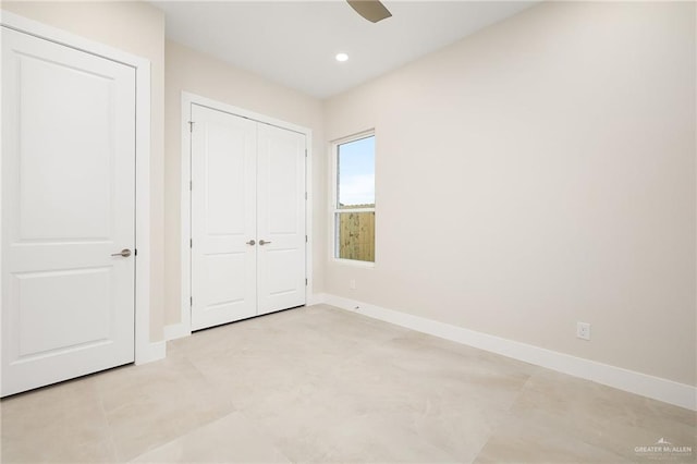 unfurnished bedroom featuring a closet and ceiling fan