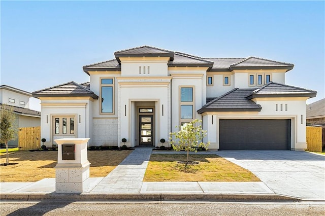 3905 Tierra Escondida, Weslaco, TX 78596 - view of front of property with a tiled roof, decorative driveway, a garage, and stucco siding