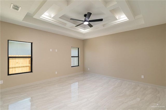 3905 Tierra Escondida, Weslaco, TX 78596 - empty room with visible vents, baseboards, a raised ceiling, ceiling fan, and coffered ceiling